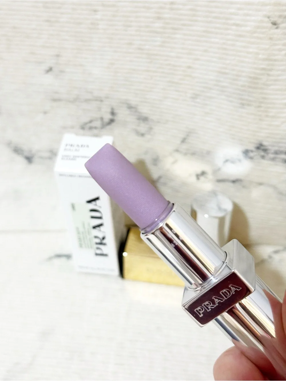 Prada Balm in U003 Wisteria Gleams PH Pinky Lilac Finish with Iridescent Shimmer